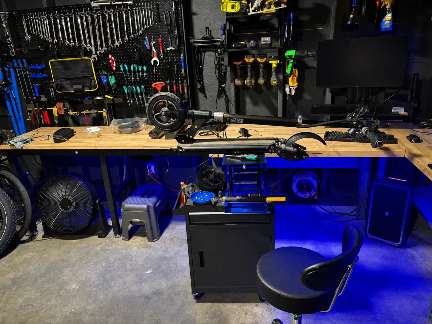An EVOLV electric scooter opened for service on the Sprocket Science repair bench