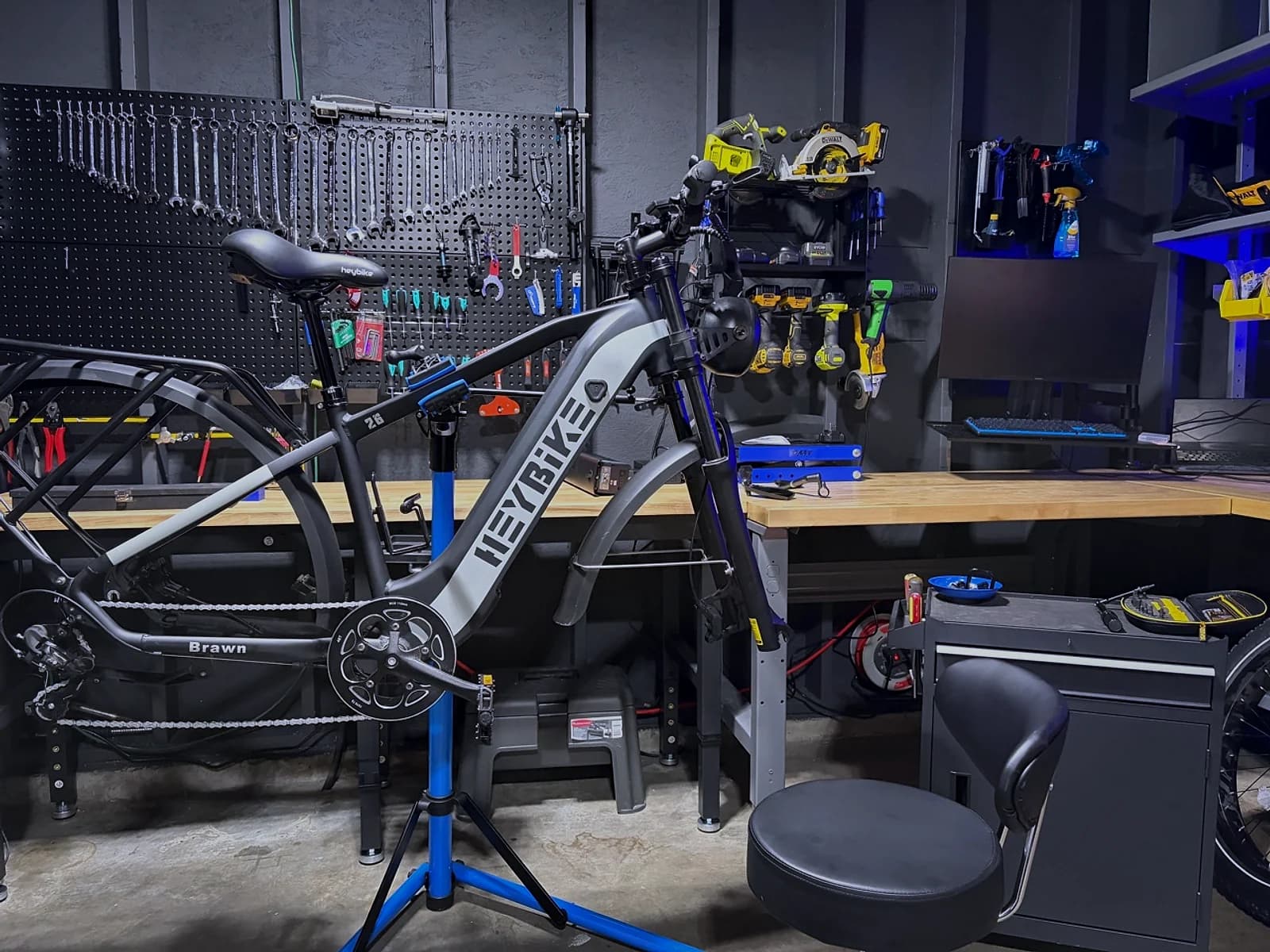 A HeyBike Brawn e-bike secured in a service stand inside the Sprocket Science workshop